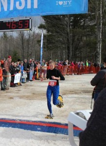 Marie Beckum of Caribou crosses the finish line at the Snowshoe World Championships held Feb. 25 in Saranac Lake, N.Y. It was one of a number of athletic events she and her husband, Thomas, have competed in over the years. (Contributed photo)